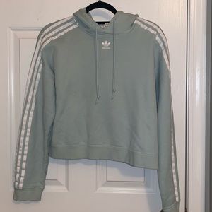 Mint green Adidas sweatshirt.